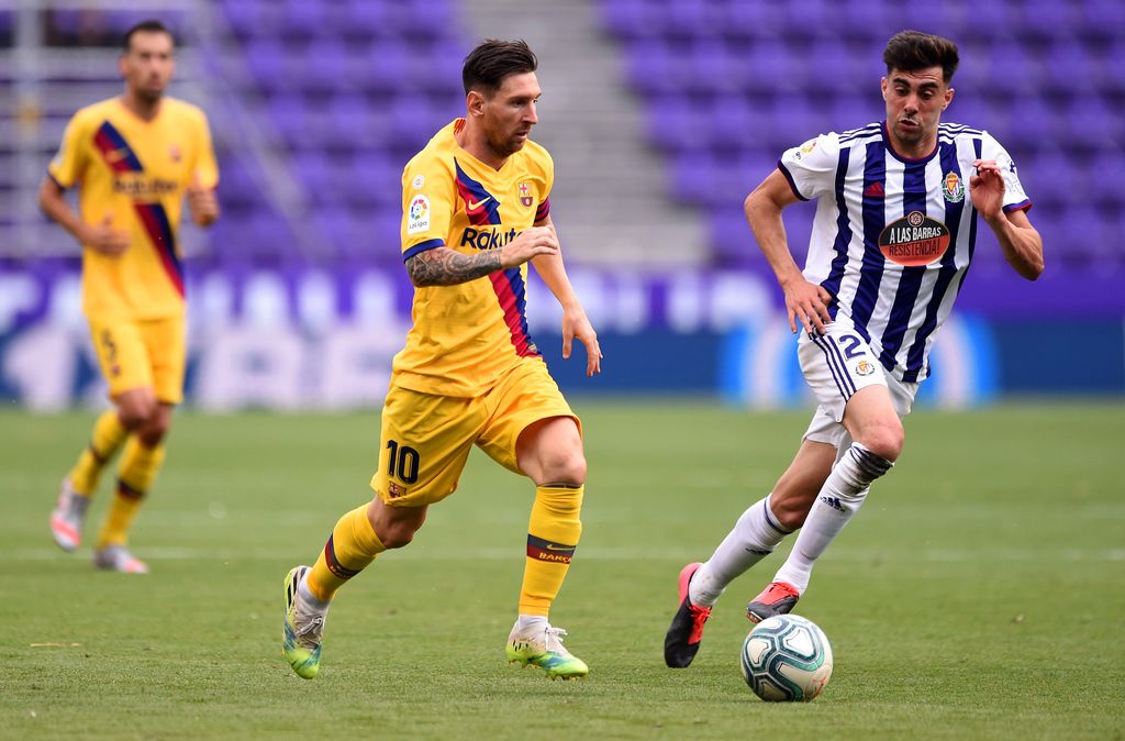 Lionel Messi VALLADOLID, SPAIN - JULY 11: Lionel Messi of Barcelona and Kike Perez of Real Valladolid battle for the ball during the Liga match between Real Valladolid CF and FC Barcelona at Jose Zorrilla on July 11, 2020 in Valladolid, Spain. Football Stadiums around Europe remain empty due to the Coronavirus Pandemic as Government social distancing laws prohibit fans inside venues resulting in all fixtures being played behind closed doors. (Photo by Denis Doyle/Getty Images)