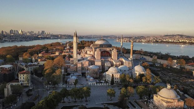 FILE-In this Saturday, April 25, 2020 file photo, an aerial view of the Byzantine-era Hagia Sophia, one of Istanbul's main tourist attractions in the historic Sultanahmet district of Istanbul.Turkey's Council of State on Friday, July 10, 2020, threw its weight behind a petition brought by a religious group and annulled a 1934 cabinet decision that changed the 6th century building into a museum. The ruling allows the government to restore the Hagia Sophia's previous status as a mosque.The decision was in line with the Turkish President's Recep Tayyip Erdogan's calls to turn the hugely symbolic world heritage site into a mosque despite widespread international criticism, including from the United States and Orthodox Christian leaders. (AP Photo)