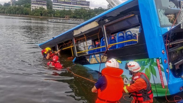Rescuers work after a bus plunged into a lake in Anshun in Chinas southwestern Guizhou province on July 7.
