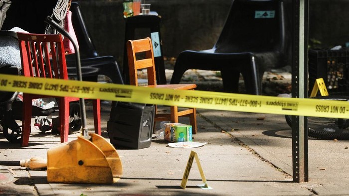 NEW YORK, NEW YORK - JULY 13: Police ballistic markers stand besides a childs chair and bicycle at a crime scene in Brooklyn where a one year old child was shot and killed on July 13, 2020 in New York City. The 1-year-old boy was shot near a playground during a Sunday picnic when gunfire erupted. Two other adults were wounded in the evening shooting. New York City has witnessed a surge in gun violence over the past month with 9 people killed, including children, and 41 others wounded on the Fourth of July weekend alone. The gun violence is occurring against the backdrop of a nationwide movement to consider defunding police departments.   Spencer Platt/Getty Images/AFP