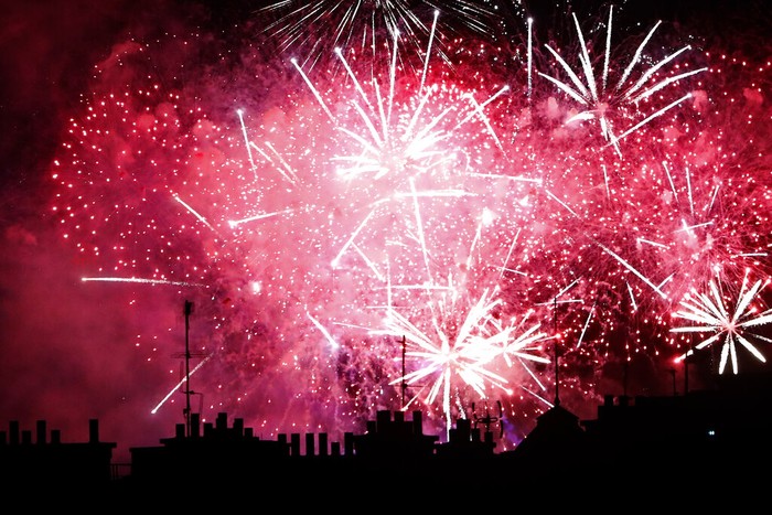 Fireworks illuminate the Paris' roofs during Bastille Day celebrations late Tuesday, July 14, 2020. (AP Photo/Thibault Camus)