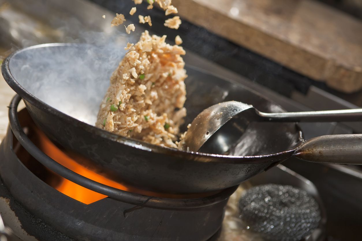 A popular fried rice dish in Indonesia and Malaysia. Served with egg, chicken satay, prawn crackers and salad garnish.