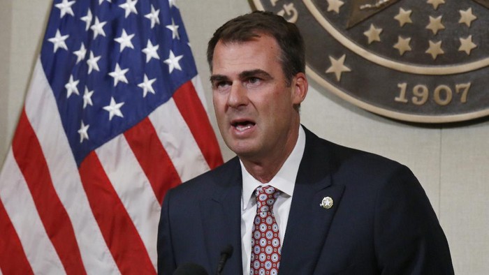 FILE - In this July 9, 2020, file photo Oklahoma Gov. Kevin Stitt speaks during a news conference in Oklahoma City. Stitt announced Wednesday, July 15, 2020, that hes tested positive for the coronavirus and that he is isolating at home. The first-term Republican governor has backed one of the countrys most aggressive reopening plans, has resisted any statewide mandate on masks and rarely wears one himself. (AP Photo/Sue Ogrocki, File)
