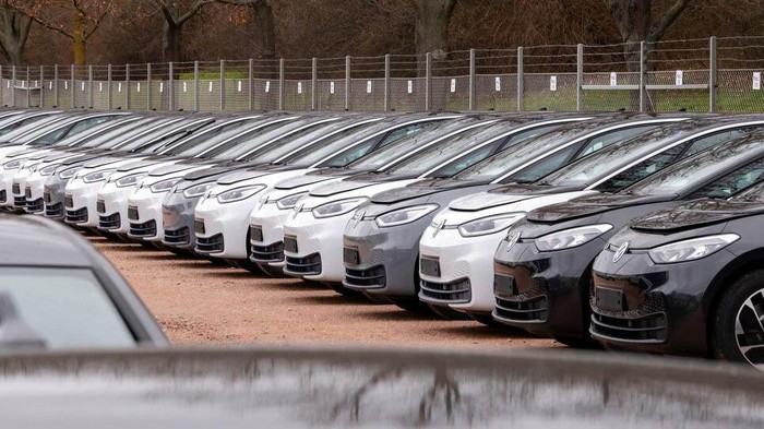 FILE- In this Tuesday, Feb. 25, 2020 file photo, workers complete an electric car ID.3 body at the assembly line during a press tour at the plant of the German manufacturer Volkswagen AG (VW) in Zwickau, Germany. The coronavirus has cancelled business plans all over the world but Europes push into electric cars isnt one of them. Sales of battery-powered and hybrid cars have held up despite a deeply painful recession, mainly thanks to the action of governments. (AP Photo/Jens Meyer, file)