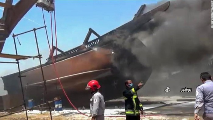 A screen grab taken from a from Iranian State TV IRIB on Wednesday showing firefighters combating a blaze at a shipyard in the Iranian city of Bushehr.
