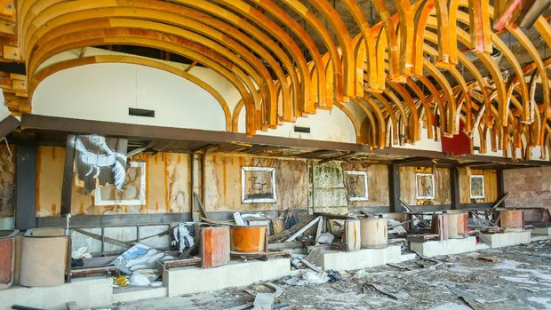 Resort Kupari Kupari, Croatia- July 19, 2017 : Devastated coffee shop of an old ruined hotel Goricina in abandoned Yugoslavian military resort in Kupari, Croatia.