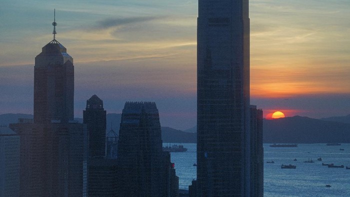 The skyline of the business district is silhouetted at sunset in Hong Kong Monday, July 13, 2020. (AP Photo/Vincent Yu)
