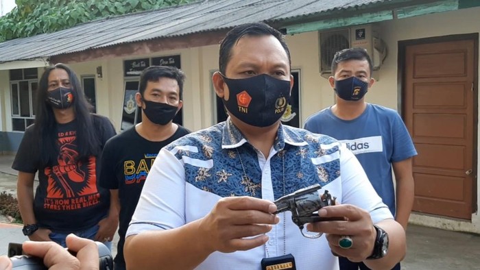 Pelaku saat diamankan di Mapolda Sumsel.