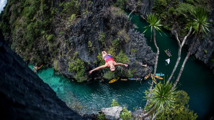 PALAWAN, PHILIPPINES - APRIL 12: (EDITORIAL USE ONLY) In this handout image provided by Red Bull, Blake Aldridge of the UK dives from a rock pinnacle at the Small Lagoon on Miniloc Island during the first competition day of the first stop of the Red Bull Cliff Diving World Series on April 12, 2019 at Palawan, Philippines. (Photo by Dean Treml/Red Bull via Getty Images)