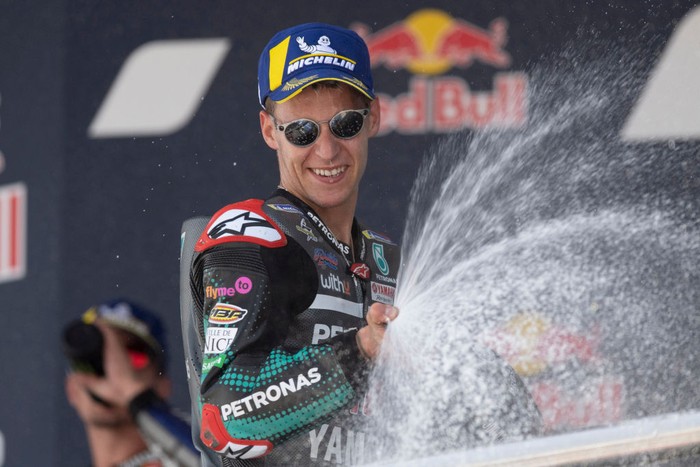 JEREZ DE LA FRONTERA, SPAIN - JULY 19: Fabio Quartararo of France and Petronas Yamaha SRT  celebrates the victory on the podium at the end of the MotoGP race during the MotoGP of Spain - Race at Circuito de Jerez on July 19, 2020 in Jerez de la Frontera, Spain. (Photo by Mirco Lazzari gp/Getty Images)