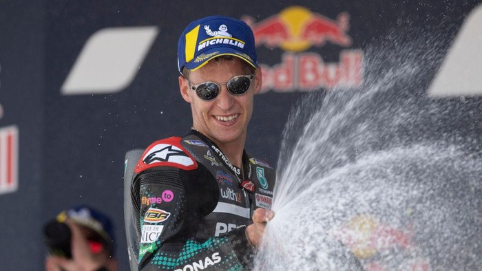 JEREZ DE LA FRONTERA, SPAIN - JULY 19: Fabio Quartararo of France and Petronas Yamaha SRT  celebrates the victory on the podium at the end of the MotoGP race during the MotoGP of Spain - Race at Circuito de Jerez on July 19, 2020 in Jerez de la Frontera, Spain. (Photo by Mirco Lazzari gp/Getty Images)