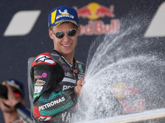 JEREZ DE LA FRONTERA, SPAIN - JULY 19: Fabio Quartararo of France and Petronas Yamaha SRT  celebrates the victory on the podium at the end of the MotoGP race during the MotoGP of Spain - Race at Circuito de Jerez on July 19, 2020 in Jerez de la Frontera, Spain. (Photo by Mirco Lazzari gp/Getty Images)