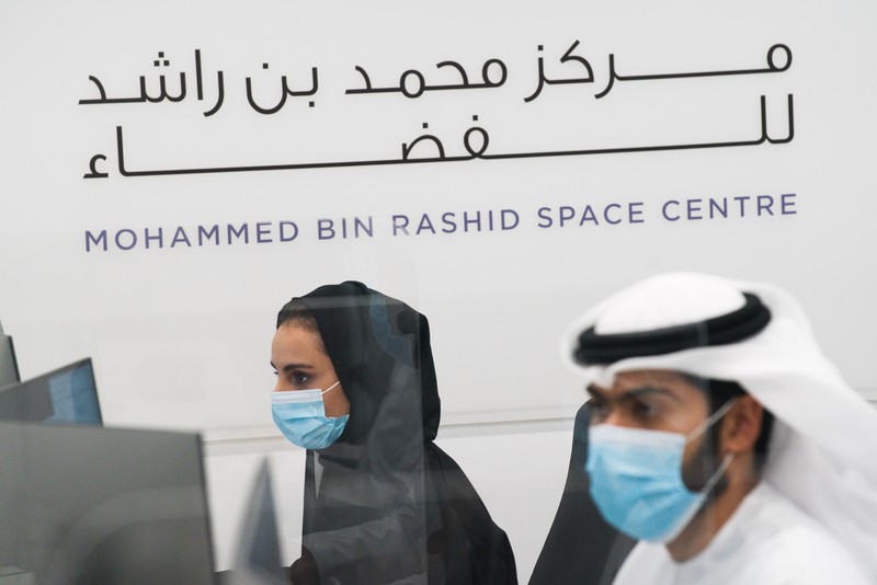 An Emirati man prepares to watch the launch of the 