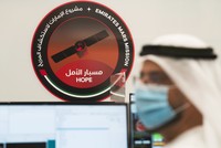 An Emirati man prepares to watch the launch of the 