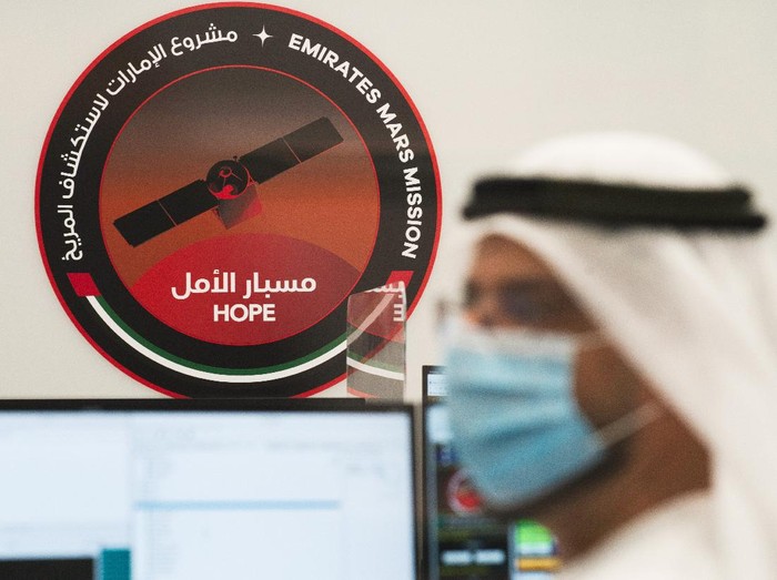An Emirati man prepares to watch the launch of the 