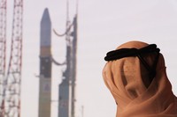 An Emirati man prepares to watch the launch of the 