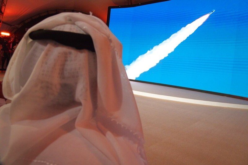 An Emirati man prepares to watch the launch of the 