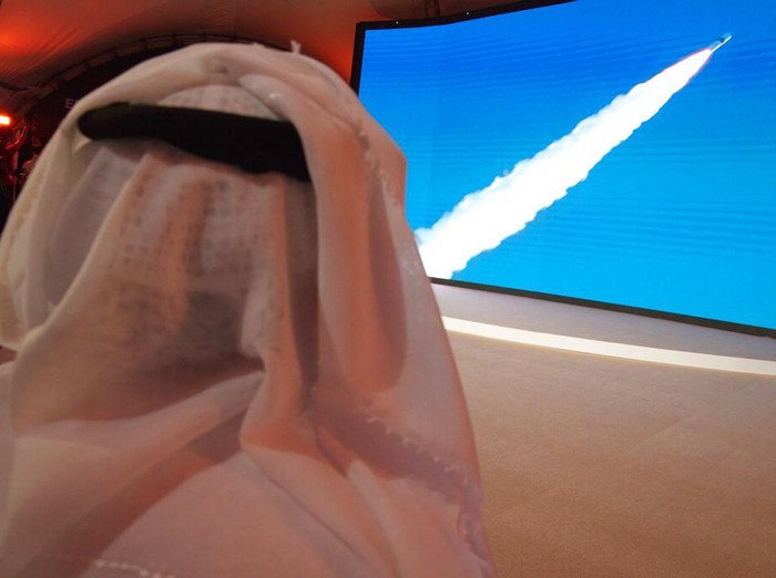 An Emirati man prepares to watch the launch of the 