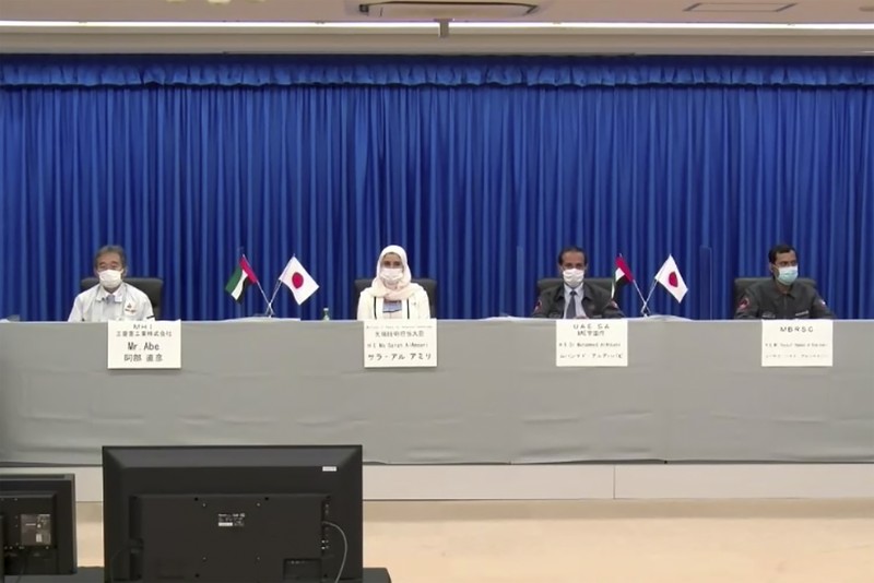 An Emirati man prepares to watch the launch of the 