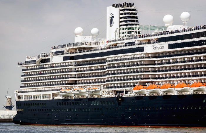 This picture taken on May 19, 2016, shows the MS Koningsdam Holland America Line arriving in the port of Rotterdam. - The ship, weighing some 99,500 tonnes, measuring some 297 meters in length, and able to accommodate some 2,650 passengers will be launched on May 20 by Dutch Queen Maxima. (Photo by Koen van Weel / ANP / AFP) / Netherlands OUT