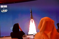 A picture taken on July 19, 2020, shows a screen broadcasting the launch of the 