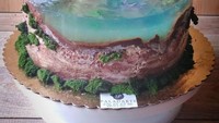 Seperti kue dengan tampilan pulau tak berpenghuni. Bedanya kue jelly ini diberi hiasan rumah kecil dan dermaga yang nampak usang. Foto: bored panda