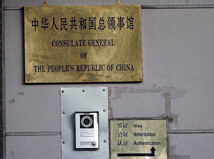 A sign directs visitors outside the Chinese Consulate General Wednesday, July 22, 2020, in Houston. Houston police and fire officials responded to reports that documents were being burned in the courtyard of the consulate Tuesday night, according to the Houston Police Department. China says the U.S. has ordered it to close its consulate in Houston in what it called a provocation that violates international law. (AP Photo/David J. Phillip)