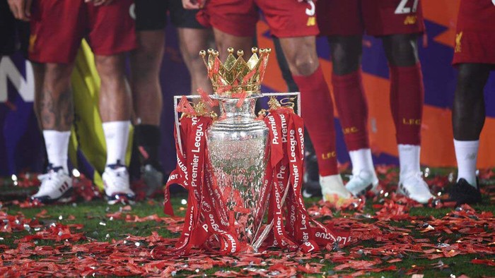 Liverpools manager Jurgen Klopp, center, reacts following the English Premier League soccer match between Liverpool and Chelsea at Anfield Stadium in Liverpool, England, Wednesday, July 22, 2020. Liverpool are champions of the EPL for the season 2019-2020. The trophy is presented at the teams last home game of the season. Liverpool won the match against Chelsea 5-3. (Laurence Griffiths, Pool via AP)