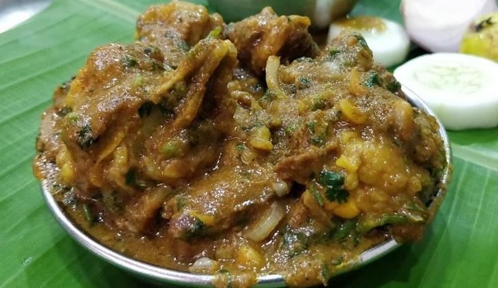 curry goat head on the plate