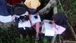 Hii.. Siswa SMP Ini Terpaksa Belajar di Makam
