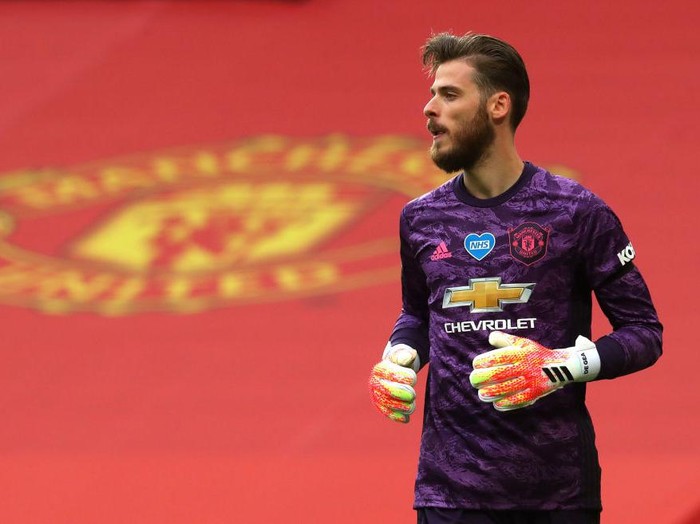 MANCHESTER, ENGLAND - JULY 22: David De Gea of Manchester United looks on during the Premier League match between Manchester United and West Ham United at Old Trafford on July 22, 2020 in Manchester, England. Football Stadiums around Europe remain empty due to the Coronavirus Pandemic as Government social distancing laws prohibit fans inside venues resulting in all fixtures being played behind closed doors. (Photo by Catherine Ivill/Getty Images)