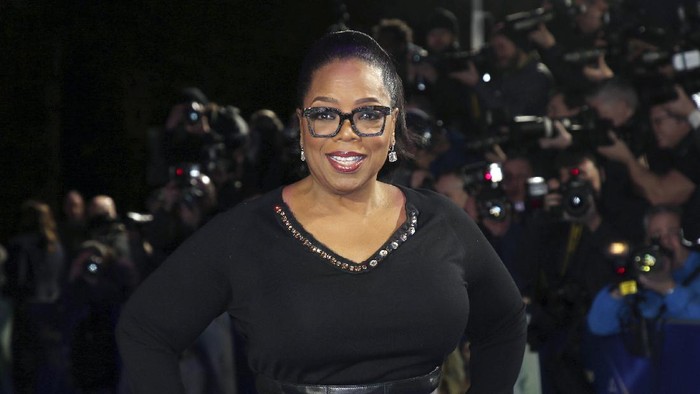 FILE - In this March 13, 2018, file photo, actress Oprah Winfrey poses for photographers upon arrival at the premiere of the film A Wrinkle In Time in London. O, The Oprah Magazine is ending its regular monthly print editions with the December 2020 issue after 20 years of publication. The brand, which is among the most recognizable magazines in the U.S., is not going away but will become more “more digitally-centric, said a Hearst spokeswoman Monday.  (Photo by Joel C Ryan/Invision/AP, File)