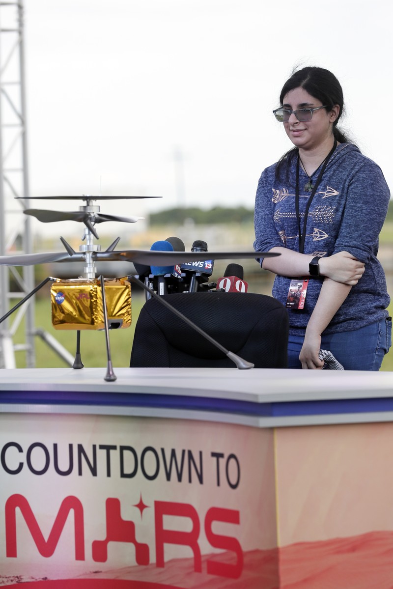 Alexander Mather, of Burke, Va. stands next to a model of the Mars 2020 rover he named in a contest during a news conference at the Kennedy Space Center Tuesday, July 28, 2020, in Cape Canaveral, Fla. Mather, submitted the winning entry in NASA's 