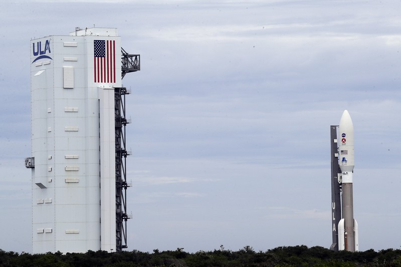 Alexander Mather, of Burke, Va. stands next to a model of the Mars 2020 rover he named in a contest during a news conference at the Kennedy Space Center Tuesday, July 28, 2020, in Cape Canaveral, Fla. Mather, submitted the winning entry in NASA's 