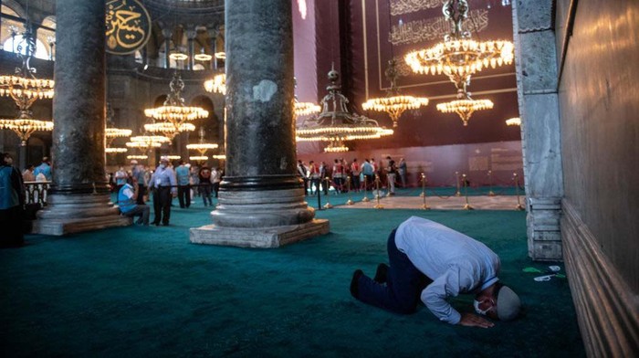 ISTANBUL, TURKEY - JULY 24: Curtains cover a Christian fresco inside the Hagia Sophia Grand Mosque after the first official Friday prayers were held on July 24, 2020 in Istanbul, Turkey. Turkey's President Recep Tayyip Erdogan attended the first Friday prayer inside the Hagia Sophia Mosque after it was officially reconverted into a mosque from a museum. The controversial decision to change the iconic buildings status came after Turkey's highest administrative court voted on July, 10 to revoke the structures status as a museum allowing it to be converted back to a mosque. Throughout it's history the UNESCO World Heritage site has served as a Byzantine Cathedral, a mosque under Ottoman rule, and most recently a museum. Thousands of worshippers from all over Turkey flocked to the site for the chance to pray inside the historic building for the first Friday prayers.   (Photo by Chris McGrath/Getty Images)