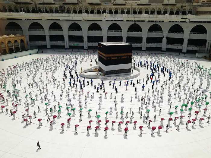 Muslim pilgrims line up as they leave after they circle the Kaaba, the cubic building at the Grand Mosque, as they keep social destination to protect themselves against Coronavirus a ahead of the Hajj pilgrimage in the Muslim holy city of Mecca, Saudi Arabia, Wednesday, July 29, 2020. During the first rites of hajj, Muslims circle the Kaaba counter-clockwise seven times while reciting supplications to God, then walk between two hills where Ibrahims wife, Hagar, is believed to have run as she searched for water for her dying son before God brought forth a well that runs to this day. (AP Photo)