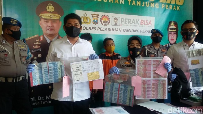 uang palsu di surabaya
