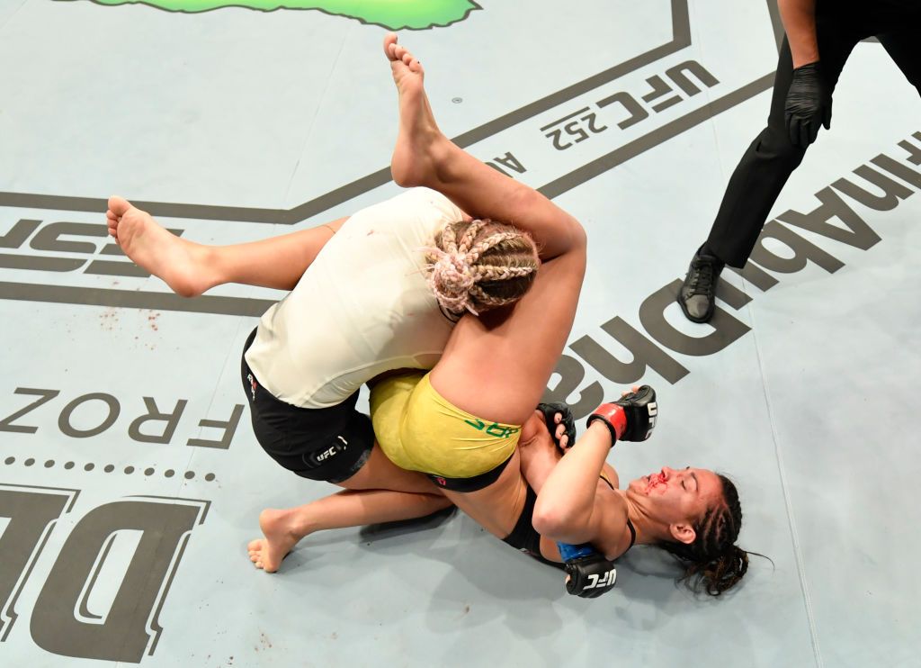 ABU DHABI, UNITED ARAB EMIRATES - JULY 12: In this handout image provided by UFC, (R-L) Amanda Ribas of Brazil secures an arm bar submission against Paige VanZant in their flyweight fight during the UFC 251 event at Flash Forum on UFC Fight Island on July 12, 2020 on Yas Island, Abu Dhabi, United Arab Emirates. (Photo by Jeff Bottari/Zuffa LLC via Getty Images)