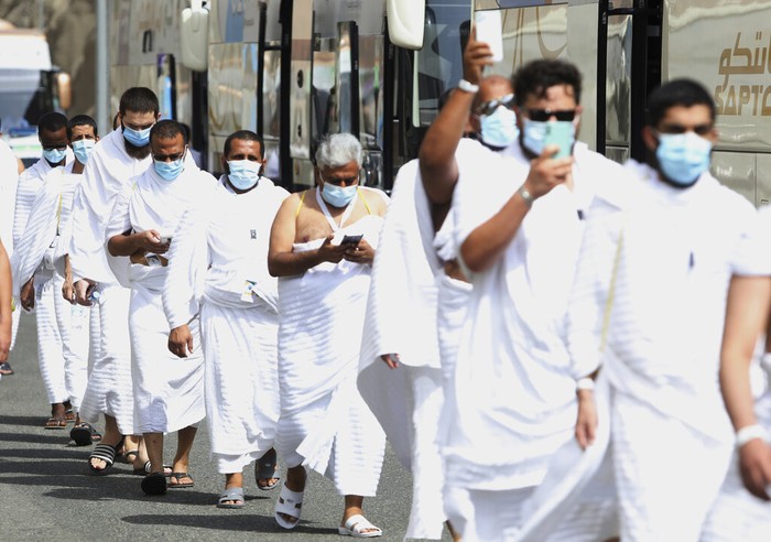 Saudi Hajj Muslim pilgrims pray inside the Namira Mosque in Arafat as they keep social distance to protect themselves against coronavirus during the annual hajj pilgrimage near the holy city of Mecca, Saudi Arabia, Thursday, July 30, 2020. This year's hajj was dramatically scaled down from 2.5 million pilgrims to as few as 1,000 due to the coronavirus pandemic. (AP Photo)