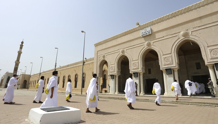 Saudi Hajj Muslim pilgrims pray inside the Namira Mosque in Arafat as they keep social distance to protect themselves against coronavirus during the annual hajj pilgrimage near the holy city of Mecca, Saudi Arabia, Thursday, July 30, 2020. This year's hajj was dramatically scaled down from 2.5 million pilgrims to as few as 1,000 due to the coronavirus pandemic. (AP Photo)