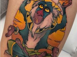 Keren! Seni Tato Gambar Kartun yang Berwarna