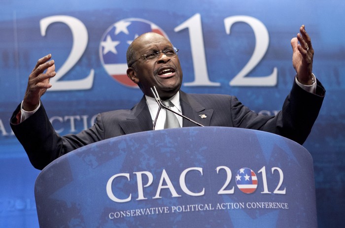FILE - In this Feb. 9, 2012 file photo, former presidential candidate Herman Cain addresses the Conservative Political Action Conference in Washington.  Cain has died after battling the coronavirus. A post on Cains Twitter account on Thursday, July 30, 2020 announced the death.   (AP Photo/J. Scott Applewhite, File)