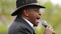 Saat itu, Cain muncul tanpa menggunakan masker. Sama seperti Trump, Cain juga salah satu tokoh yang tegas menolak penggunaan masker. AP Photo/Genevieve Ross.