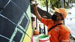 Melihat Mural Kece dari Pasukan Oranye