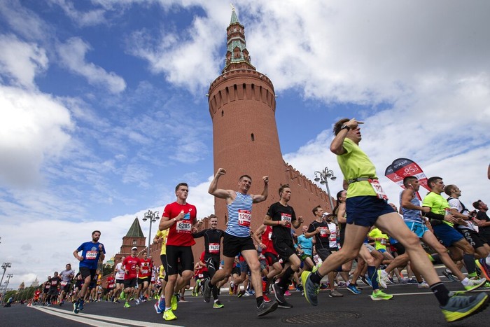 People run past the Kremlin Wall as they take part in a half-marathon in Moscow, Russia, Sunday, Aug., 2, 2020. Around 17,000 people took part in the race. (AP Photo/Alexander Zemlianichenko Jr)