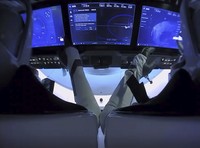NASA astronauts Robert Behnken, left, and Douglas Hurley are seen inside the SpaceX Crew Dragon Endeavour spacecraft onboard the SpaceX GO Navigator recovery ship shortly after having landed in the Gulf of Mexico off the coast of Pensacola, Fla., Sunday, Aug. 2, 2020. The Demo-2 test flight for NASAs Commercial Crew Program was the first to deliver astronauts to the International Space Station and return them safely to Earth onboard a commercially built and operated spacecraft. Behnken and Hurley returned after spending 64 days in space. (Bill Ingalls/NASA via AP)