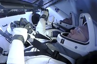 NASA astronauts Robert Behnken, left, and Douglas Hurley are seen inside the SpaceX Crew Dragon Endeavour spacecraft onboard the SpaceX GO Navigator recovery ship shortly after having landed in the Gulf of Mexico off the coast of Pensacola, Fla., Sunday, Aug. 2, 2020. The Demo-2 test flight for NASAs Commercial Crew Program was the first to deliver astronauts to the International Space Station and return them safely to Earth onboard a commercially built and operated spacecraft. Behnken and Hurley returned after spending 64 days in space. (Bill Ingalls/NASA via AP)