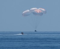 NASA astronauts Robert Behnken, left, and Douglas Hurley are seen inside the SpaceX Crew Dragon Endeavour spacecraft onboard the SpaceX GO Navigator recovery ship shortly after having landed in the Gulf of Mexico off the coast of Pensacola, Fla., Sunday, Aug. 2, 2020. The Demo-2 test flight for NASAs Commercial Crew Program was the first to deliver astronauts to the International Space Station and return them safely to Earth onboard a commercially built and operated spacecraft. Behnken and Hurley returned after spending 64 days in space. (Bill Ingalls/NASA via AP)