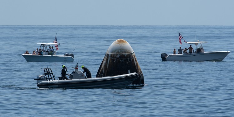 NASA astronauts Robert Behnken, left, and Douglas Hurley are seen inside the SpaceX Crew Dragon Endeavour spacecraft onboard the SpaceX GO Navigator recovery ship shortly after having landed in the Gulf of Mexico off the coast of Pensacola, Fla., Sunday, Aug. 2, 2020. The Demo-2 test flight for NASAs Commercial Crew Program was the first to deliver astronauts to the International Space Station and return them safely to Earth onboard a commercially built and operated spacecraft. Behnken and Hurley returned after spending 64 days in space. (Bill Ingalls/NASA via AP)