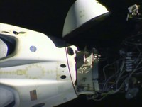NASA astronauts Robert Behnken, left, and Douglas Hurley are seen inside the SpaceX Crew Dragon Endeavour spacecraft onboard the SpaceX GO Navigator recovery ship shortly after having landed in the Gulf of Mexico off the coast of Pensacola, Fla., Sunday, Aug. 2, 2020. The Demo-2 test flight for NASAs Commercial Crew Program was the first to deliver astronauts to the International Space Station and return them safely to Earth onboard a commercially built and operated spacecraft. Behnken and Hurley returned after spending 64 days in space. (Bill Ingalls/NASA via AP)